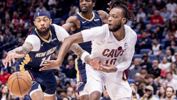 Mar 13, 2024; New Orleans, Louisiana, USA; Cleveland Cavaliers guard Darius Garland (10) looks to pass the ball against New Orleans Pelicans forward Brandon Ingram (14) during the first half at Smoothie King Center.